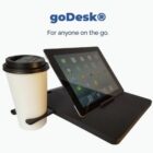 goDesk Tray Table Travel Companion attached to StrongBags Vortex Voyager luggage handle creating a portable workspace.
