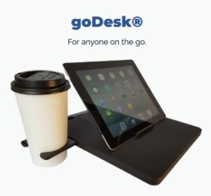 goDesk Tray Table Travel Companion attached to StrongBags Vortex Voyager luggage handle creating a portable workspace.